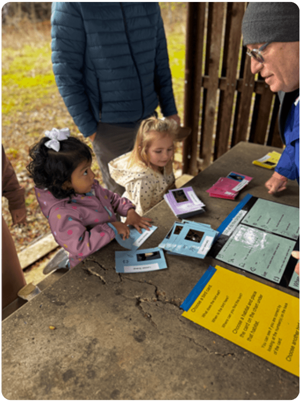 kindergartener talking to volunteer